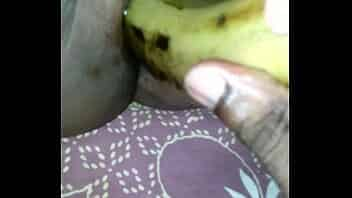 Tamil girl play with banana